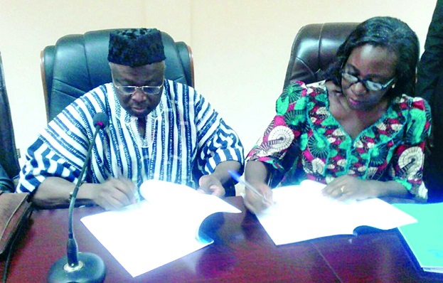 Prof. D.D Kuupole and Mrs Christine Bampoe Henaku signing the agreement 